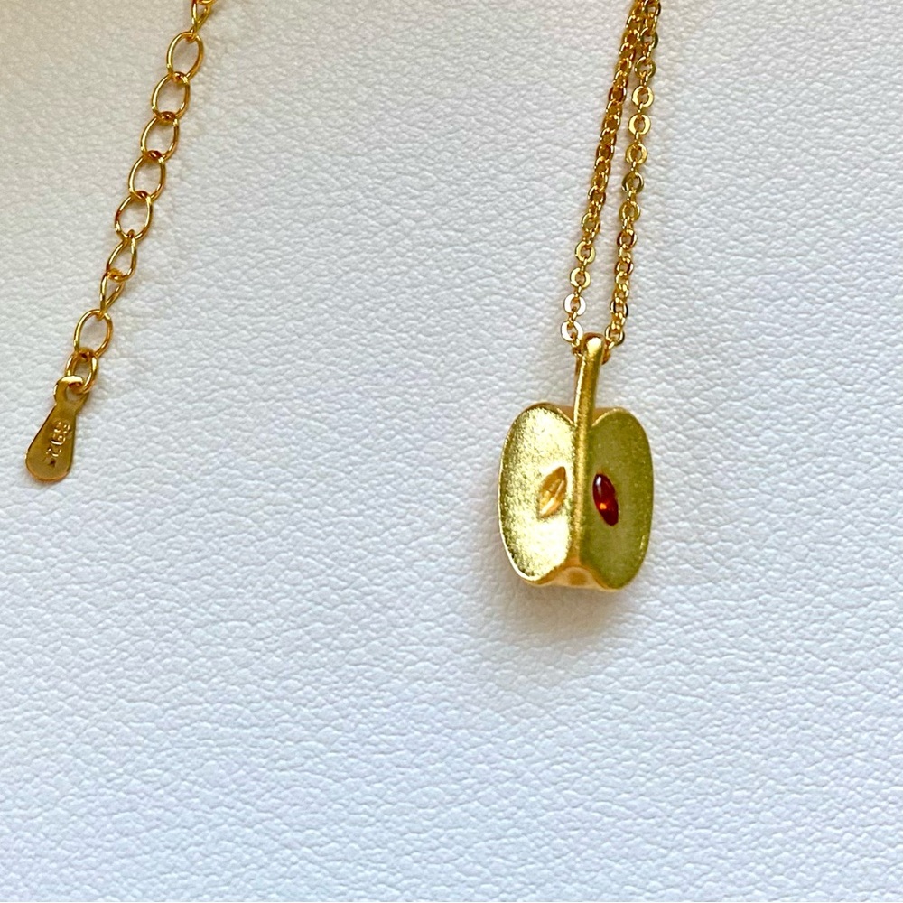 Gold Apple Pendant Necklace with Red Seed Accent